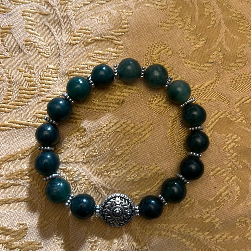 Handcrafted beaded bracelet with metal bead detail